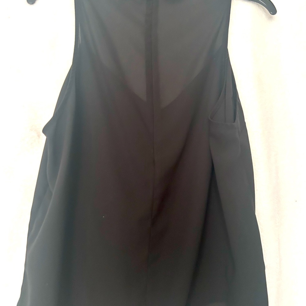Black top no sleeves looks like a tank top from the front